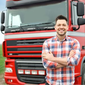 heavy vehicle operator next to truck